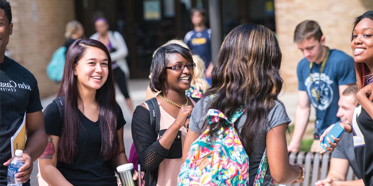 students having casual discussion outdoors